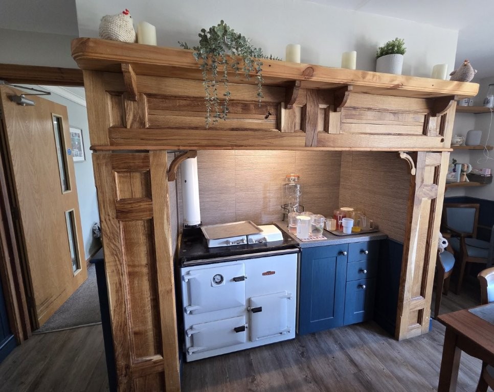 Farmhouse-style dining room fireplace at West Heanton